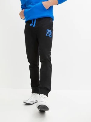 Spodnie sportowe z kontrastowymi elementami bonprix