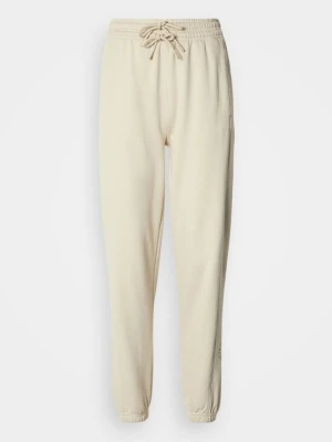 Spodnie treningowe Adidas by Stella McCartney beżowy