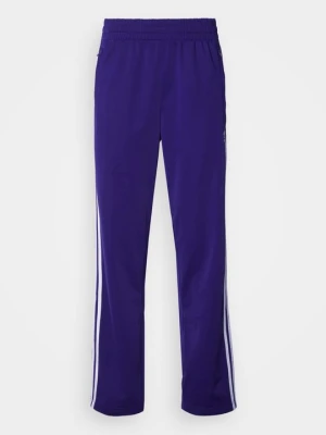 Spodnie treningowe adidas Originals fioletowy