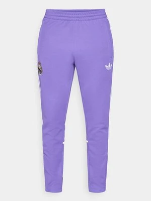 Spodnie treningowe Adidas fioletowy
