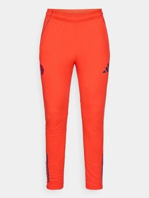 Spodnie treningowe Adidas czerwony