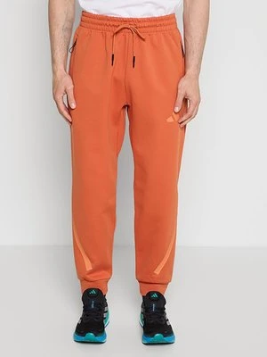 Spodnie treningowe Adidas pomarańczowy