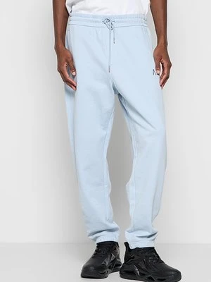 Spodnie treningowe Armani Exchange jasnoniebieski