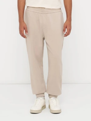 Spodnie treningowe Armani Exchange błękit królewski melanż