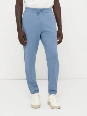 Spodnie treningowe Armani Exchange jasnoniebieski
