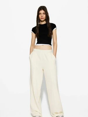 Spodnie treningowe Bershka beżowy