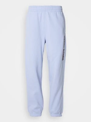 Spodnie treningowe Calvin Klein jasnoniebieski