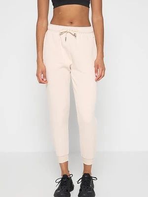 Spodnie treningowe Calvin Klein beżowy