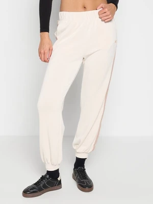 Spodnie treningowe EA7 Emporio Armani mleczny