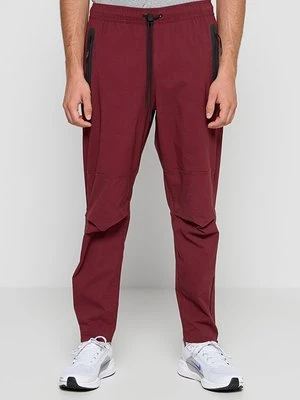 Spodnie treningowe Nike bordowy