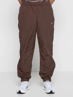 Spodnie treningowe Nike brązowy