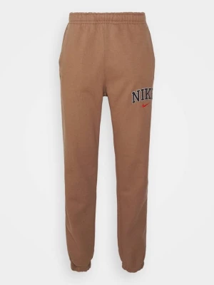 Spodnie treningowe Nike brązowy