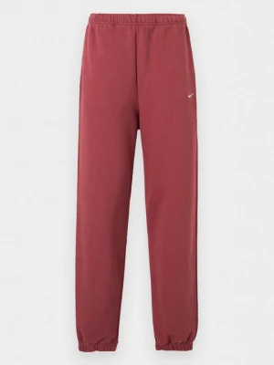 Spodnie treningowe Nike jasnoczerwony