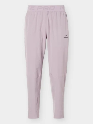 Spodnie treningowe Nike liliowy