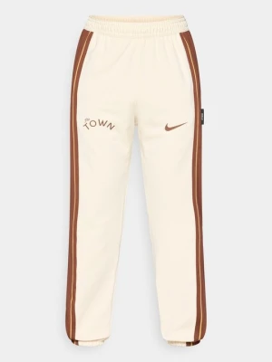 Spodnie treningowe Nike mleczny