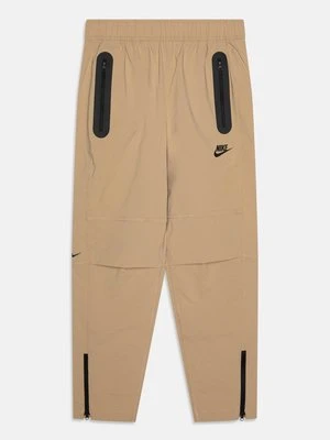 Spodnie treningowe Nike beżowy