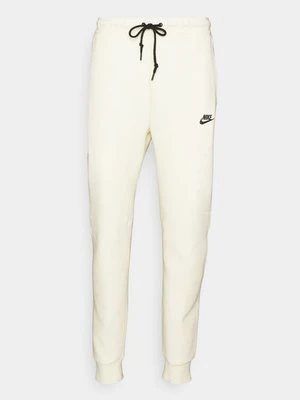 Spodnie treningowe Nike mleczny