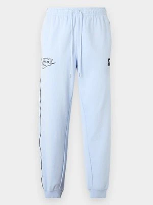 Spodnie dresowe Nike jasnoniebieski