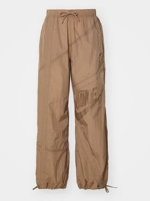 Spodnie treningowe Nike brązowy
