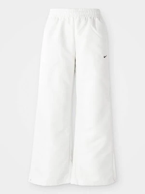 Spodnie treningowe Nike mleczny