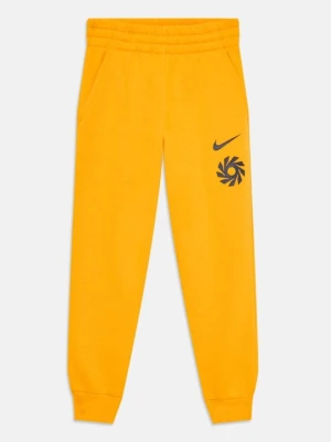 Spodnie treningowe Nike złoty