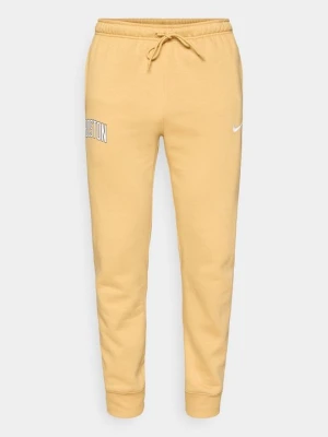 Spodnie treningowe Nike w kolorze złota