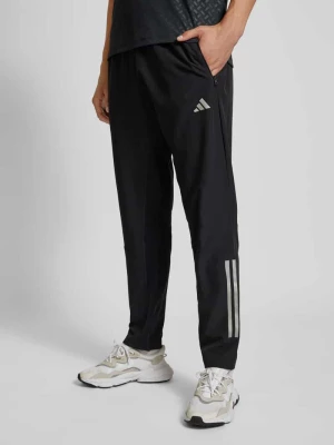 Spodnie treningowe o kroju regular fit z kieszeniami zapinanymi na zamek błyskawiczny Adidas Training