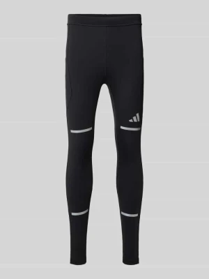 Spodnie treningowe o kroju slim fit z odblaskowymi detalami model 'adi' Adidas Czarny