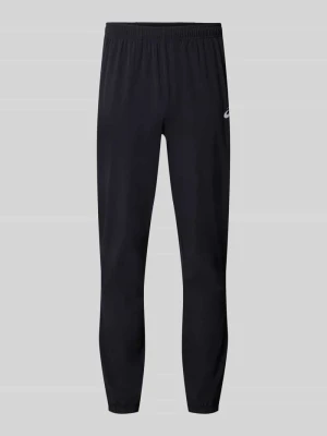 Spodnie treningowe o kroju straight fit z nadruk z logo model 'Core' Asics Czarny