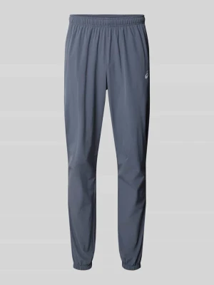 Spodnie treningowe o kroju straight fit z nadruk z logo model 'Core' Asics Średnioszary