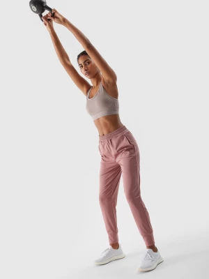Spodnie treningowe szybkoschnące damskie - pudrowy róż 4F