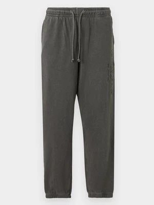 Spodnie treningowe Tommy Jeans czarny