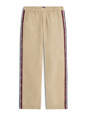 Spodnie treningowe Tommy Jeans w kolorze złota