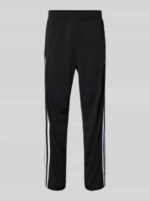 Spodnie treningowe z kieszeniami zapinanymi na zamek błyskawiczny model ‘FIREBIRD’ adidas Originals