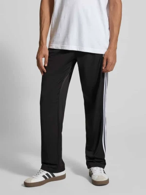 Spodnie treningowe z kieszeniami zapinanymi na zamek błyskawiczny model ‘FIREBIRD’ adidas Originals