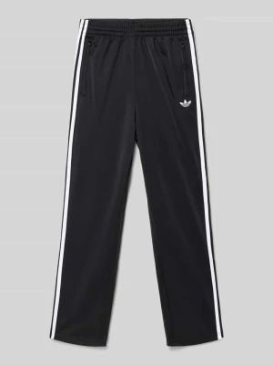 Spodnie treningowe z kieszeniami zapinanymi na zamek błyskawiczny model ‘FIREBIRD’ adidas Originals