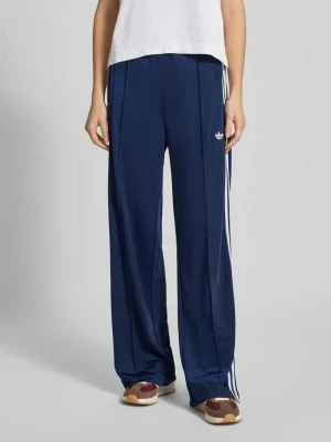Spodnie treningowe z logo i elastycznym pasem model ‘FIREBIRD’ adidas Originals