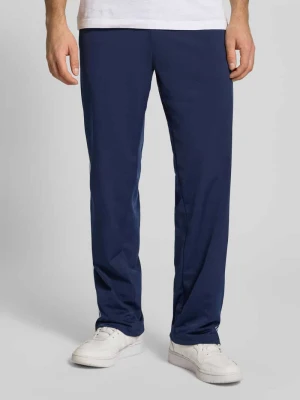 Spodnie treningowe z paskami w kontrastowym kolorze i kieszeniami zapinanymi na zamek błyskawiczny adidas Originals