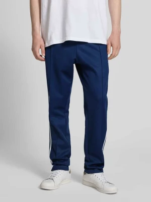 Spodnie treningowe z wyhaftowanym logo i elastycznym pasem adidas Originals