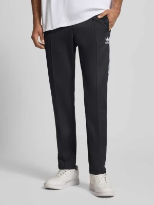 Spodnie treningowe z wyhaftowanym logo model ‘BECKENBAUER’ adidas Originals
