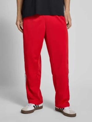 Spodnie treningowe z zatrzaskami po bokach i elastycznym pasem adidas Originals