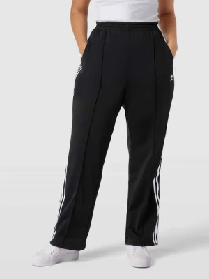 Spodnie typu track pants PLUS SIZE z wyhaftowanym logo model ‘Firebird’ Adidas Originals Plus