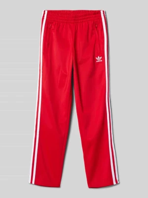 Zdjęcie produktu Spodnie typu track pants z detalem z logo adidas Originals