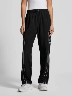 Spodnie typu track pants z nadrukiem z logo model ‘Coach’ LOVE SCARS