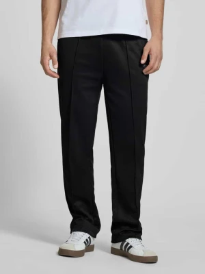 Spodnie typu track pants z pionowymi przeszyciami model 'Motus' Pegador