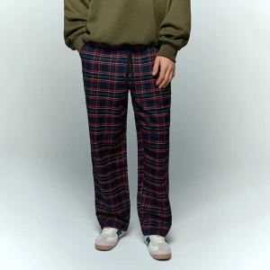 Spodnie w granatowo-czerwoną kratkę House