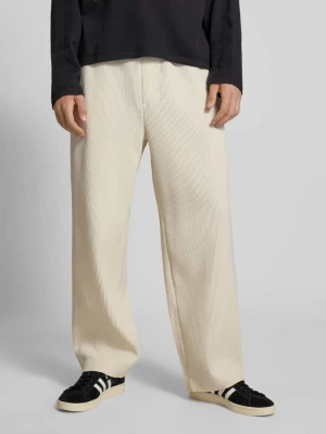 Spodnie z elastycznym pasem i trokami ściągającymi REVIEW