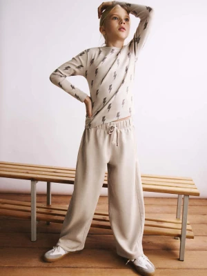 Spodnie z elastycznym pasem różowy - Dzieci - lata - MANGO KIDS