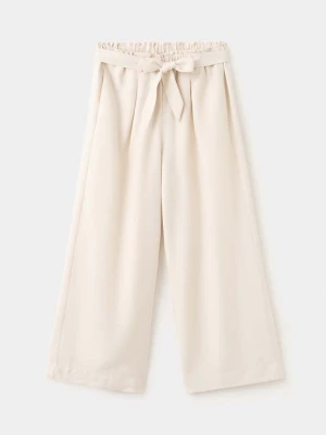 Spodnie z prostymi nogawkami i wiązaniem w pasie beżowy - Dzieci - lata - MANGO KIDS