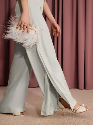 Spodnie z rozcięciem w pastelowym miętowym odcieniu TARANKO